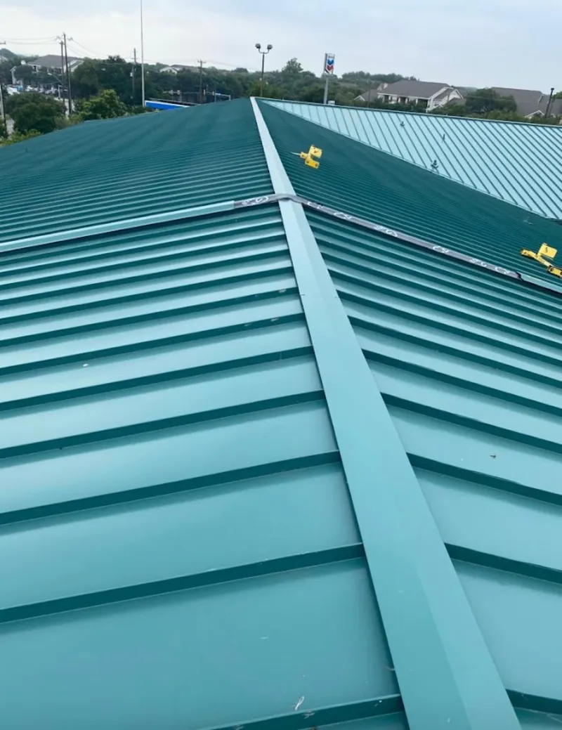 Green commercial metal roof ridge and valley for Metal Roof Repair in Kennebunk